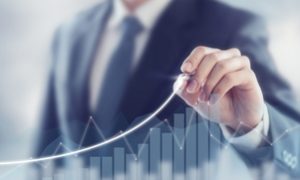 Development and growth concept. Businessman plan growth and increase of positive indicators in his business.